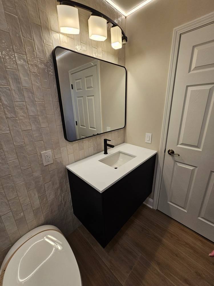 Floating black vanity with zellige tile wall β bathroom renovation Barrington IL
