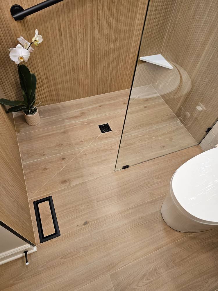 Finished shower floor with black square drain β bathroom remodel Barrington